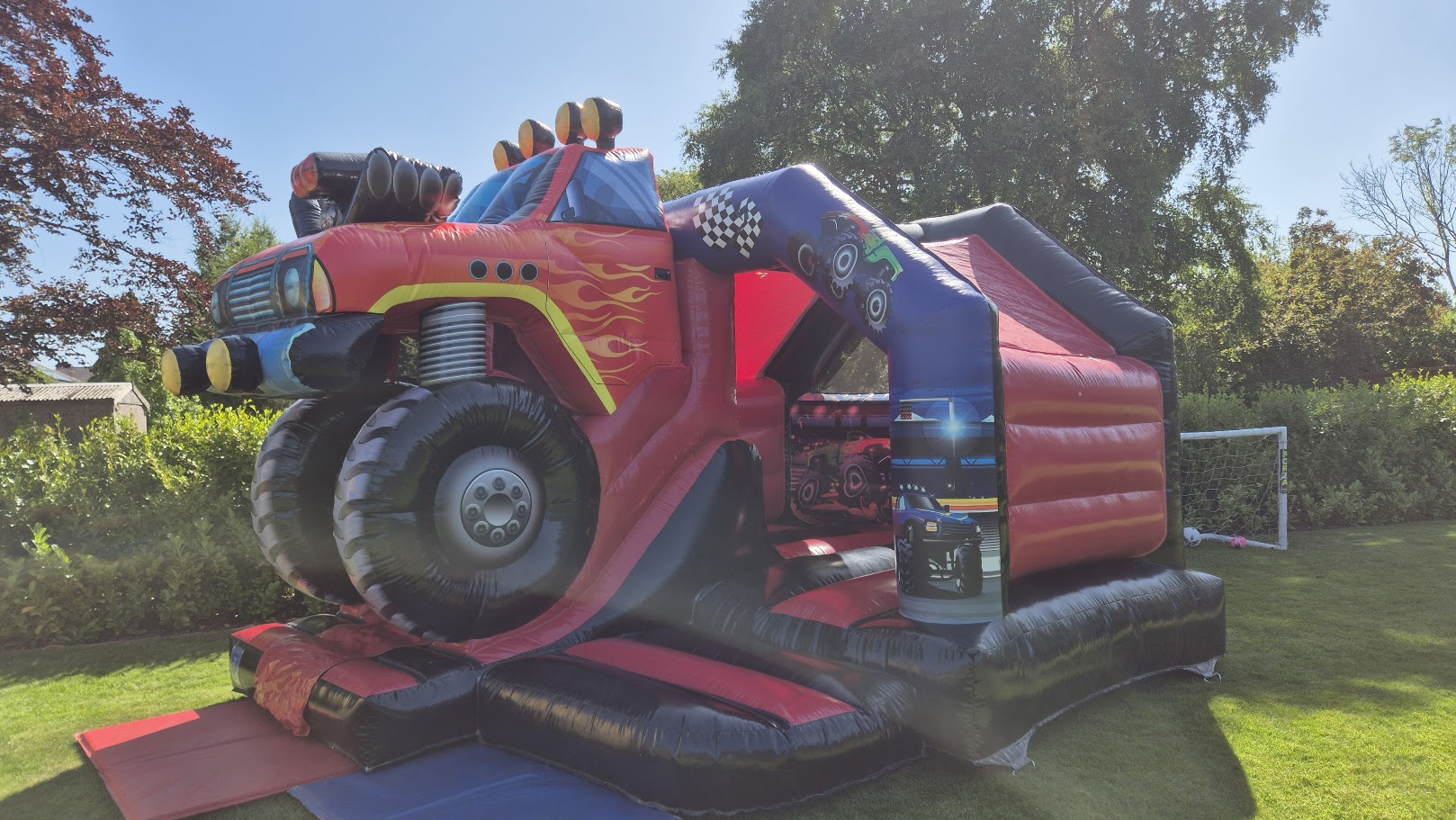 Monster Truck bouncy castle and slide combo setup for a children's party in Offerton, SK2.
