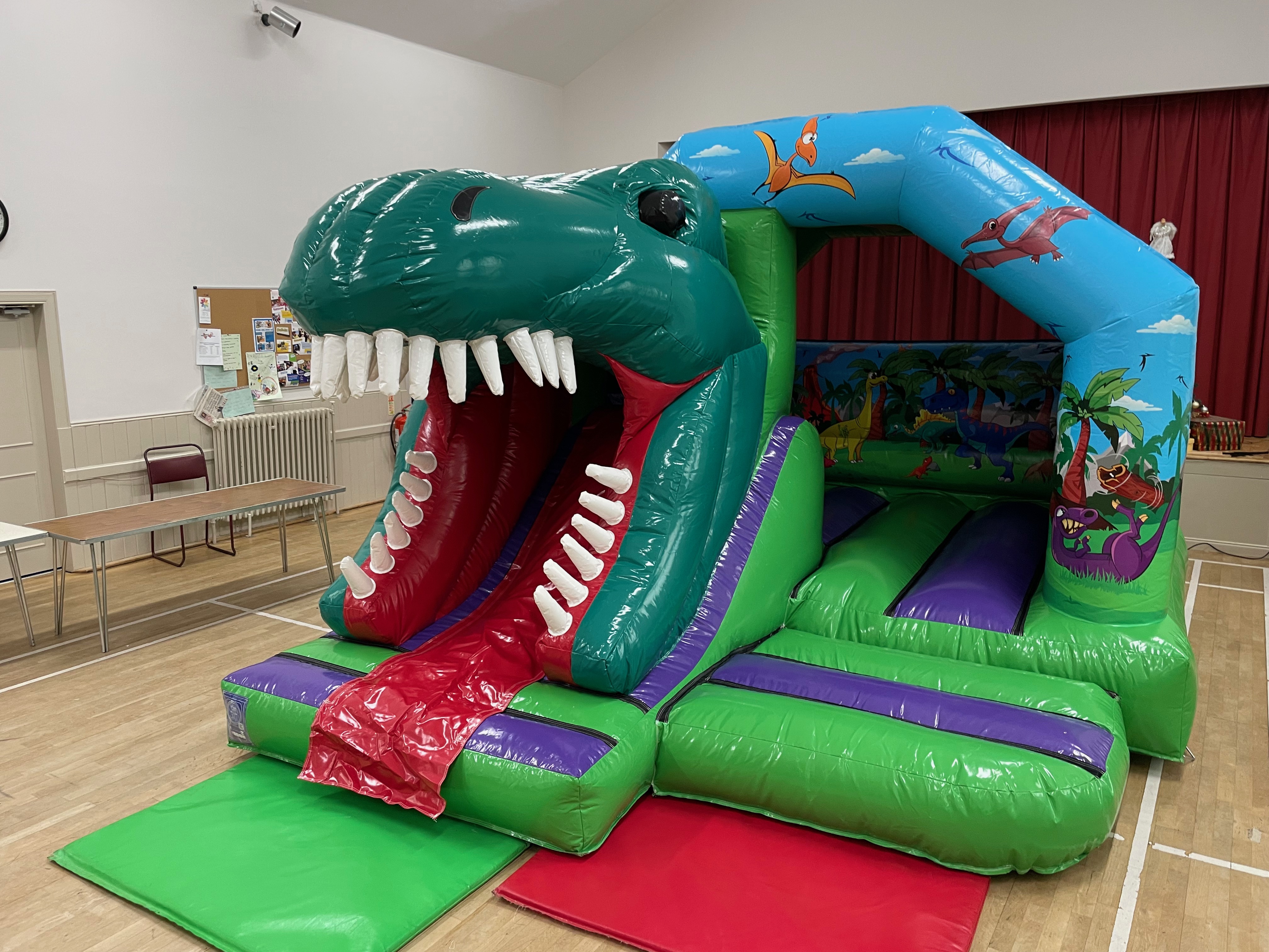 Professional dinosaur bouncy castle hire in Stockport.